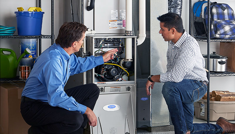 HVAC technician evaluating a furnace for repair or replacement in Sun City West