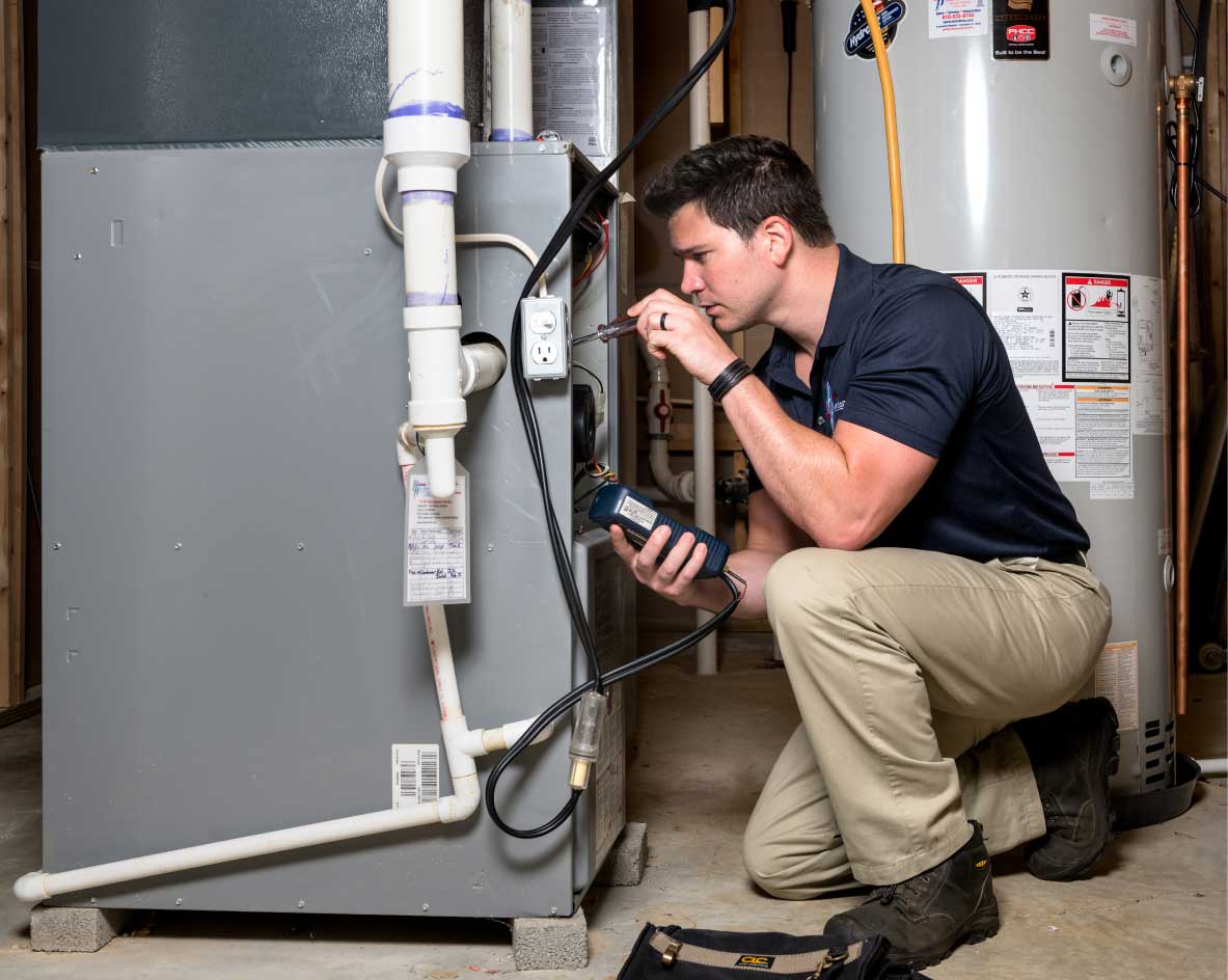 HVAC technician performing a furnace tune-up in Sun City West
