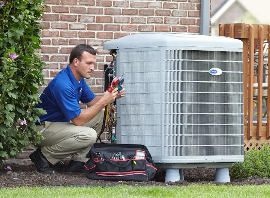 HVAC technician inspecting an outdoor air conditioning unit in Sun City West